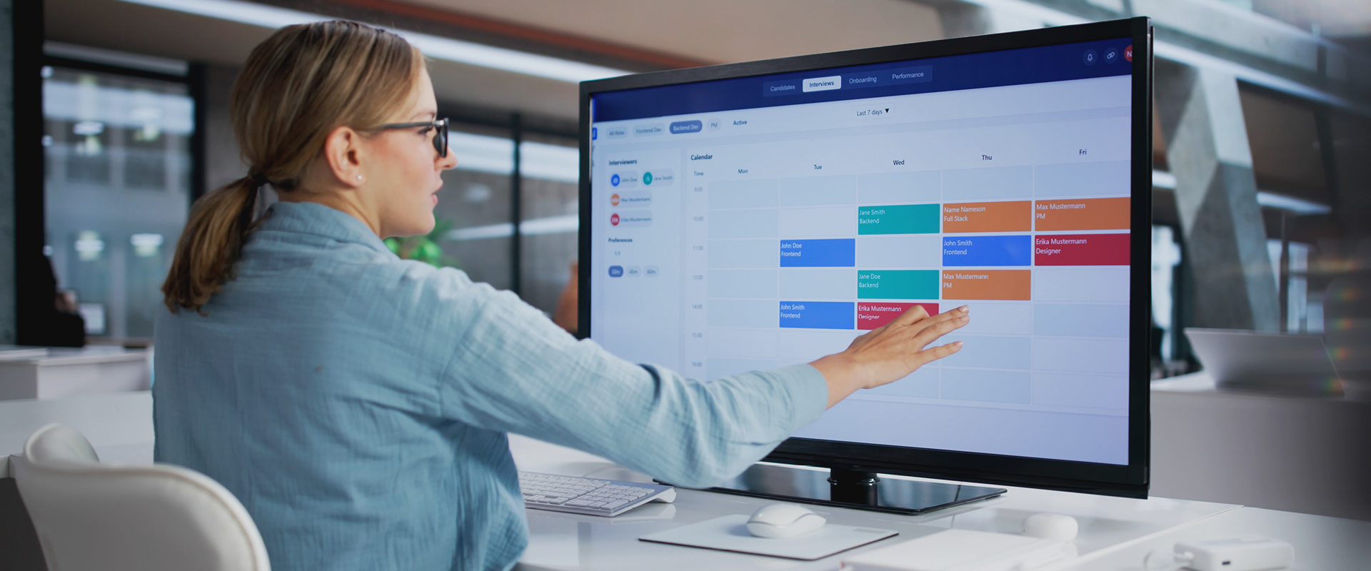 Man charting graph on computer screen